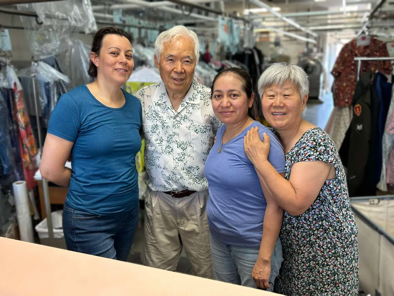 The Vogue Cleaners team together on the shop floor, Arden Way