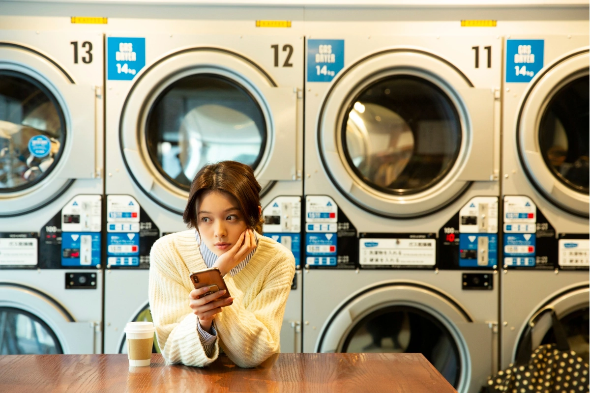 A woman at the laundromat, Why Professional Laundry Services Isn’t Just for Fancy Fabrics