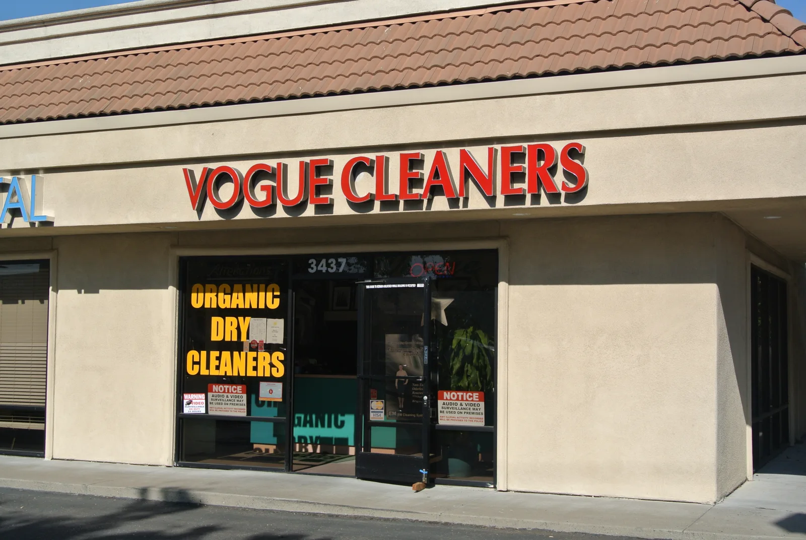 Vogue Cleaners storefront on Arden Way, 1992