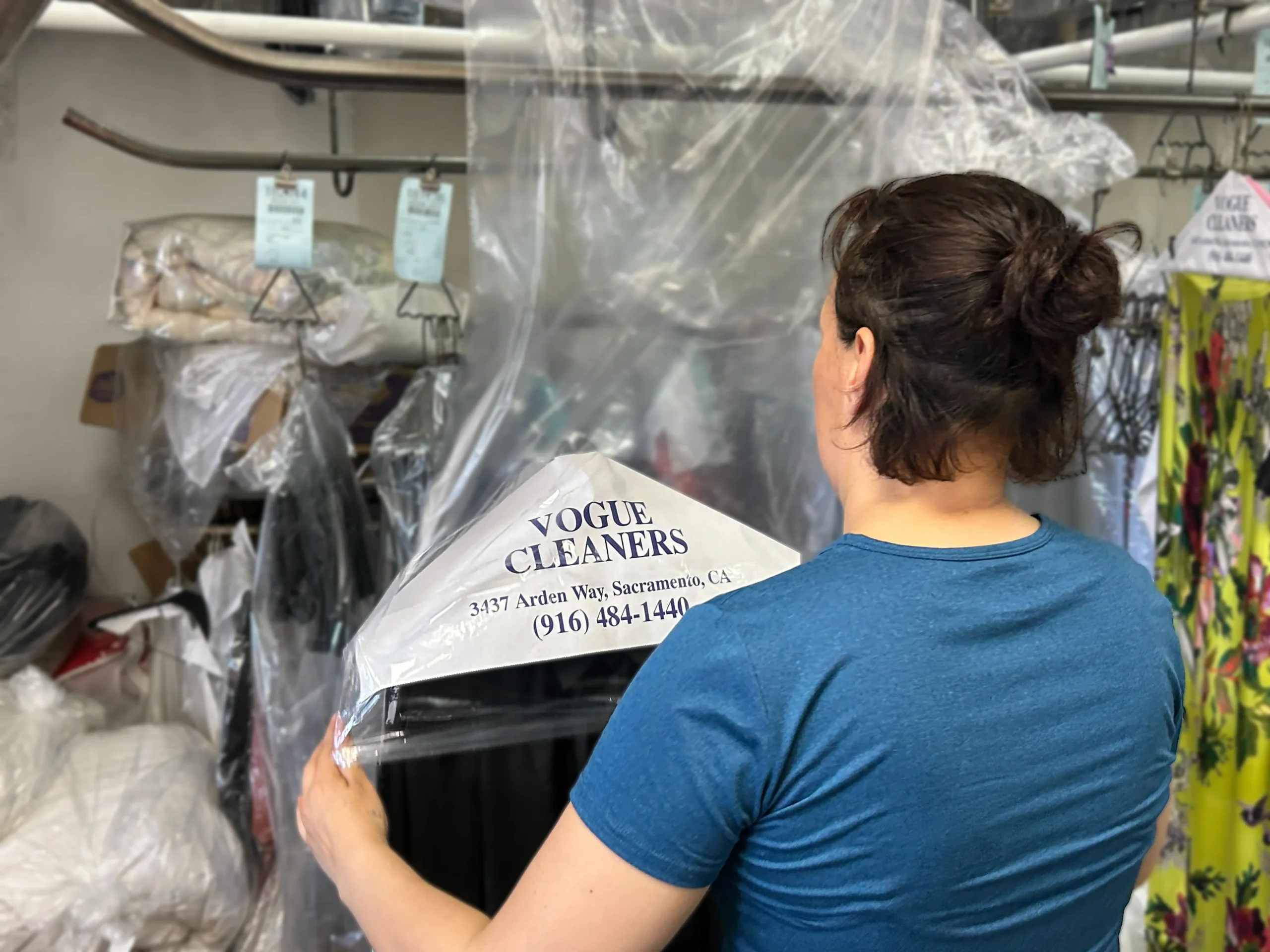 Vogue Cleaners tagging and sorting each item